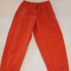 Nike Women's Vintage Red Swoosh Woven Pants in size L.